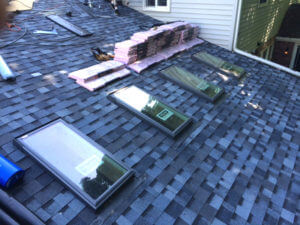 new roof and skylights being installed on house