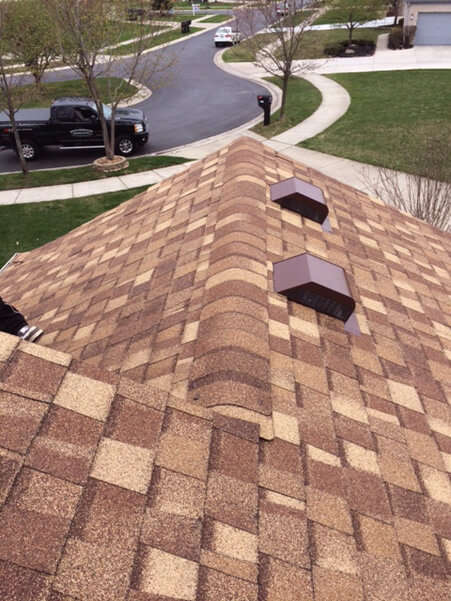 brown and tan shingles on house roof