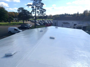 white roof coating system on hospital building