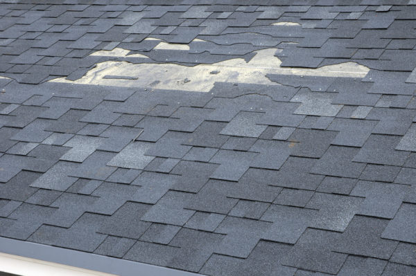 a close up view of shingles a roof damage