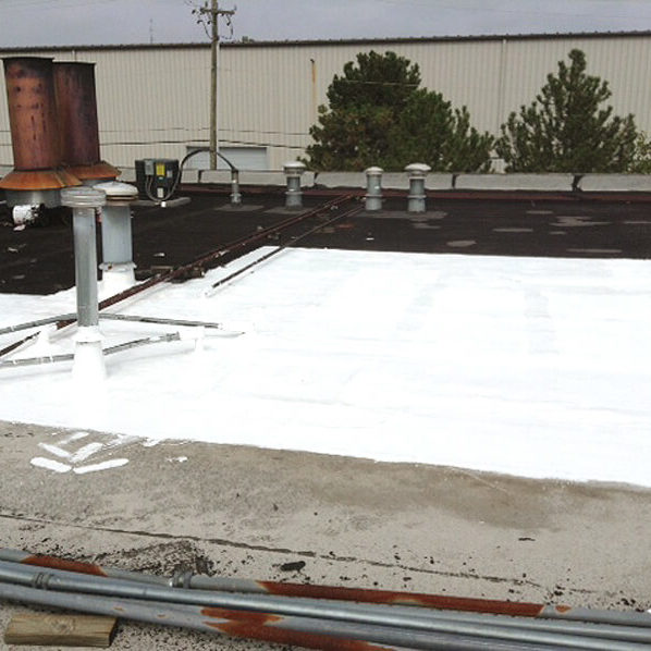 flat roof repair with white silicone roof coating