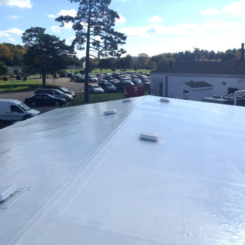white roof coating system on hospital building